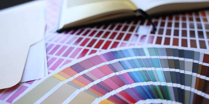 A colorful array of color swatches laid out on a table