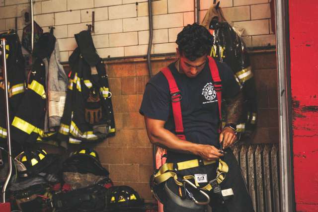 Firefighter standing inside fire station