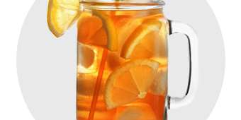 A pitcher of ice team with lemon for liquid beverages.